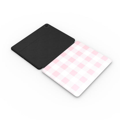 Blush buffalo check iPad case with the Apple Pencil in its slot