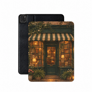 Bookshop at Dusk iPad case — storybook bookshop with glowing windows, shown front and back