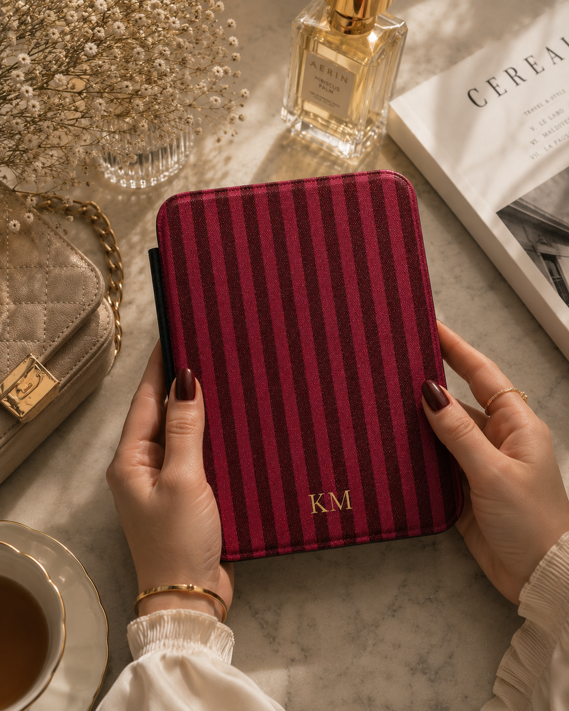 Burgundy pinstripe Kindle case with debossed monogram initials close-up — Maison Noir personalized