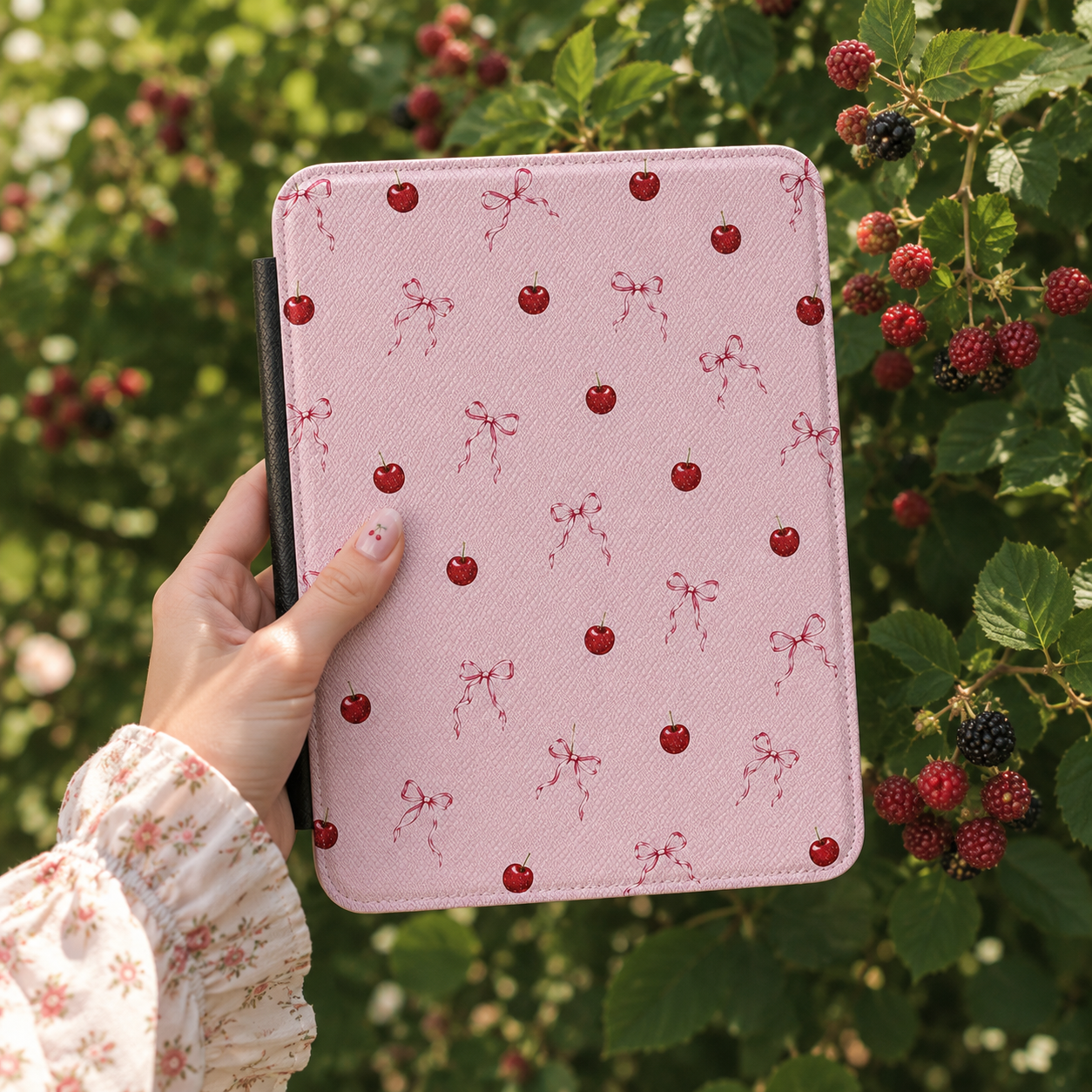 Cherries and Bows Kindle case open showing e-ink Kindle on right interior panel