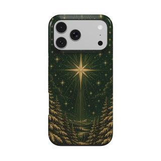 Christmas star iPhone case — gold star over a snowy pine forest on deep green, MagSafe phone case, front view