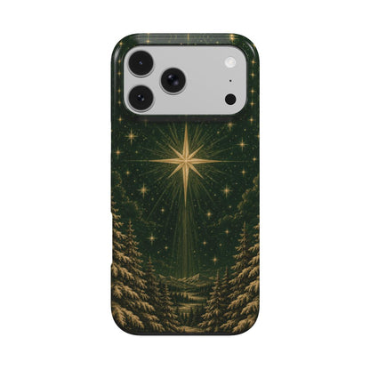 Christmas star iPhone case — gold star over a snowy pine forest on deep green, MagSafe phone case, front view
