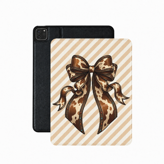 Cowhide bow iPad case in tan stripe with a large beaded cow print bow