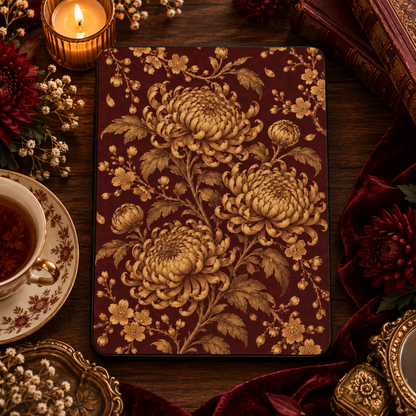 Gilded Chrysanthemum iPad case styled with a candle, a cup of tea and burgundy velvet