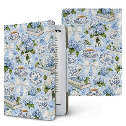 Hydrangea Tea Party Kindle case — blue hydrangeas, blue-and-white china and lace bows on sky blue, printed front and back