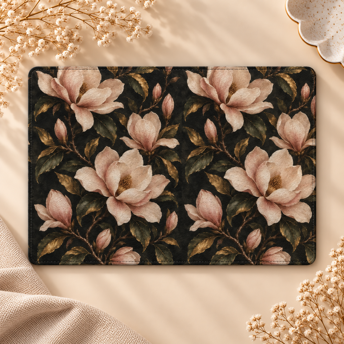 Midnight Magnolia Kindle case opened flat, front and back — blush magnolias and gold-edged leaves on black