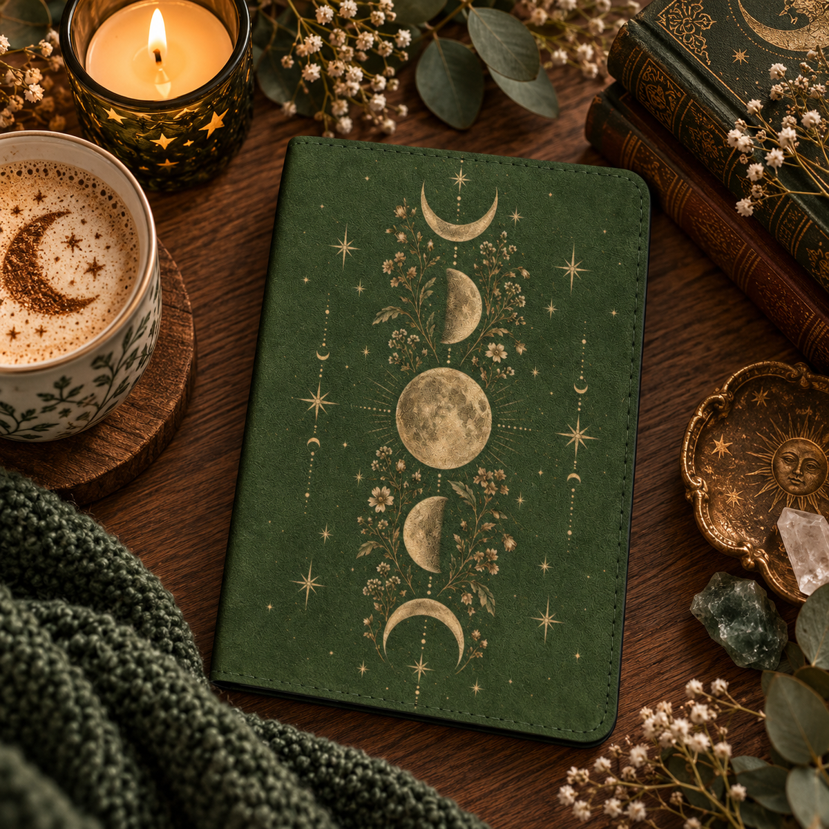 Moss Moon Phases Kindle case — gold moon phases on moss green, styled with a latte, candle and old books