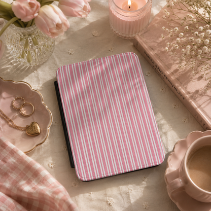Pink candy stripe Kindle case open showing black interior — Coquette Reader ticking print