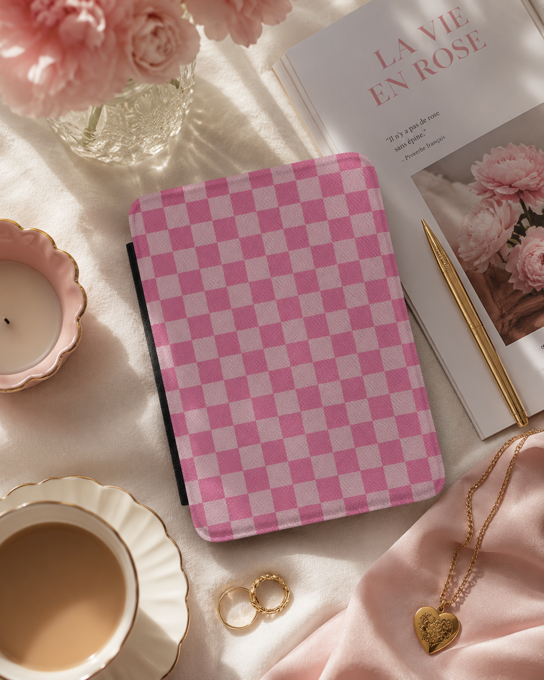 Pink checkerboard Kindle case open showing black interior — Coquette Reader gingham