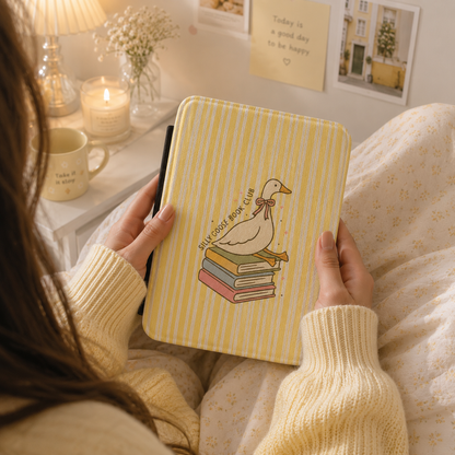 Reading goose Kindle case front cover close-up — Jardin Secret butter yellow stripe