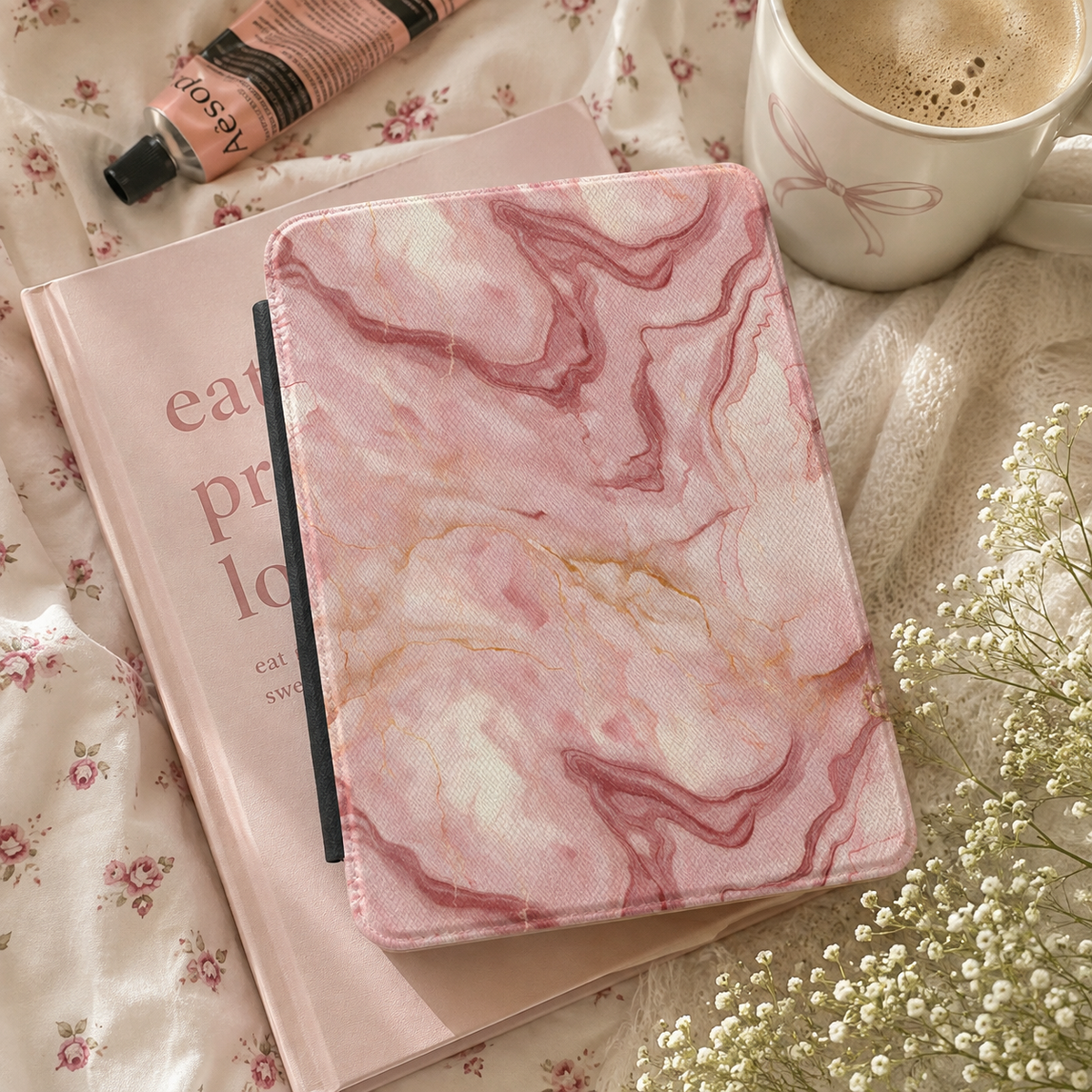 Rose marble Kindle case open, showing the Kindle mounted on the right interior panel