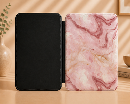 Rose marble Kindle case held in one hand with the elastic hand strap