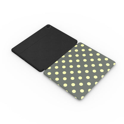 Slate and lemon polka dot iPad case with the Apple Pencil in its slot