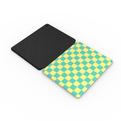 Teal and yellow checkerboard iPad case with the Apple Pencil in its slot