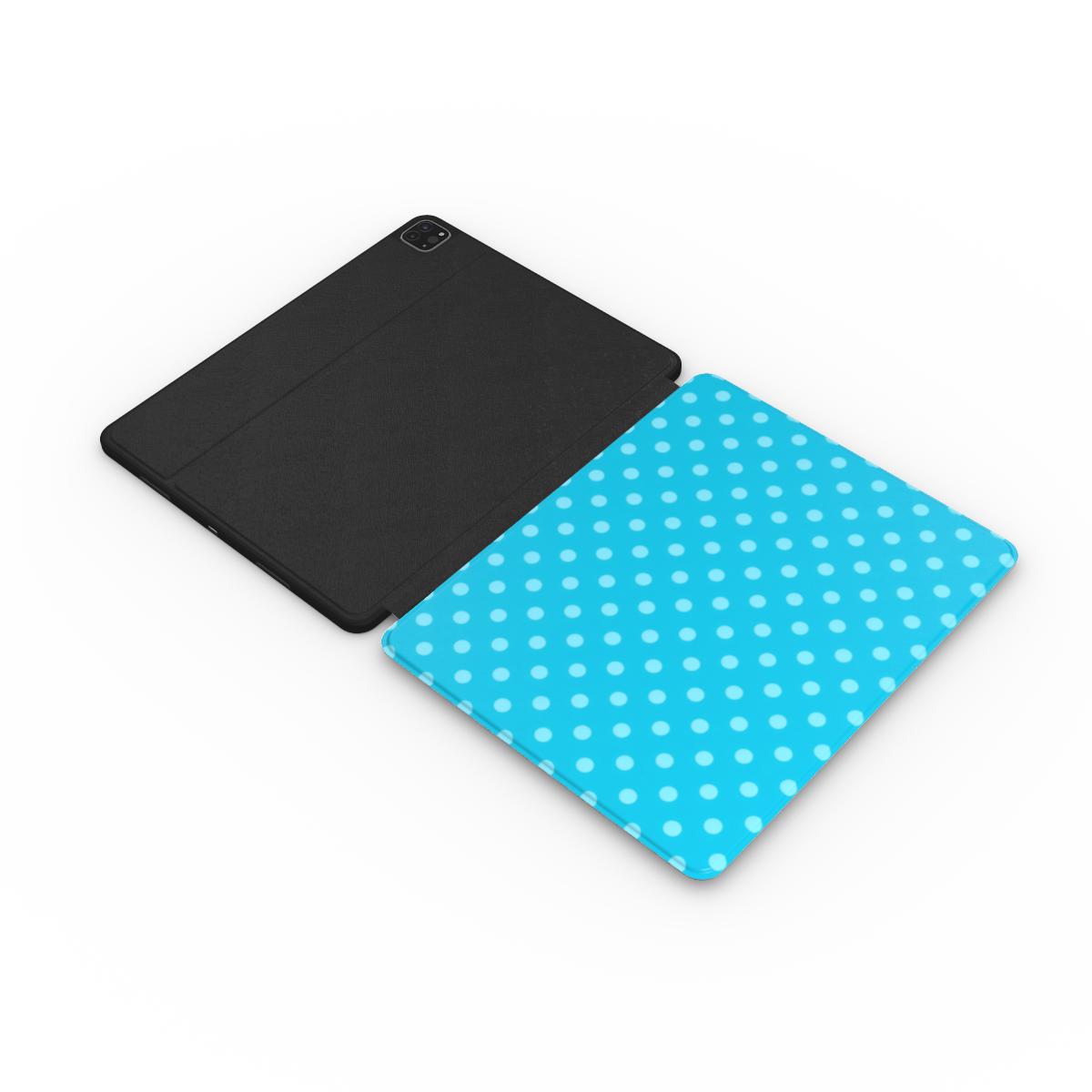 Turquoise polka dot iPad case with the Apple Pencil charging in its cutout